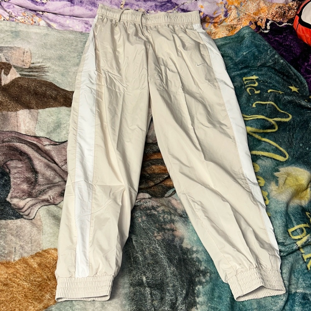 NIKE TRACK PANTS light cream color with white stripes on the side